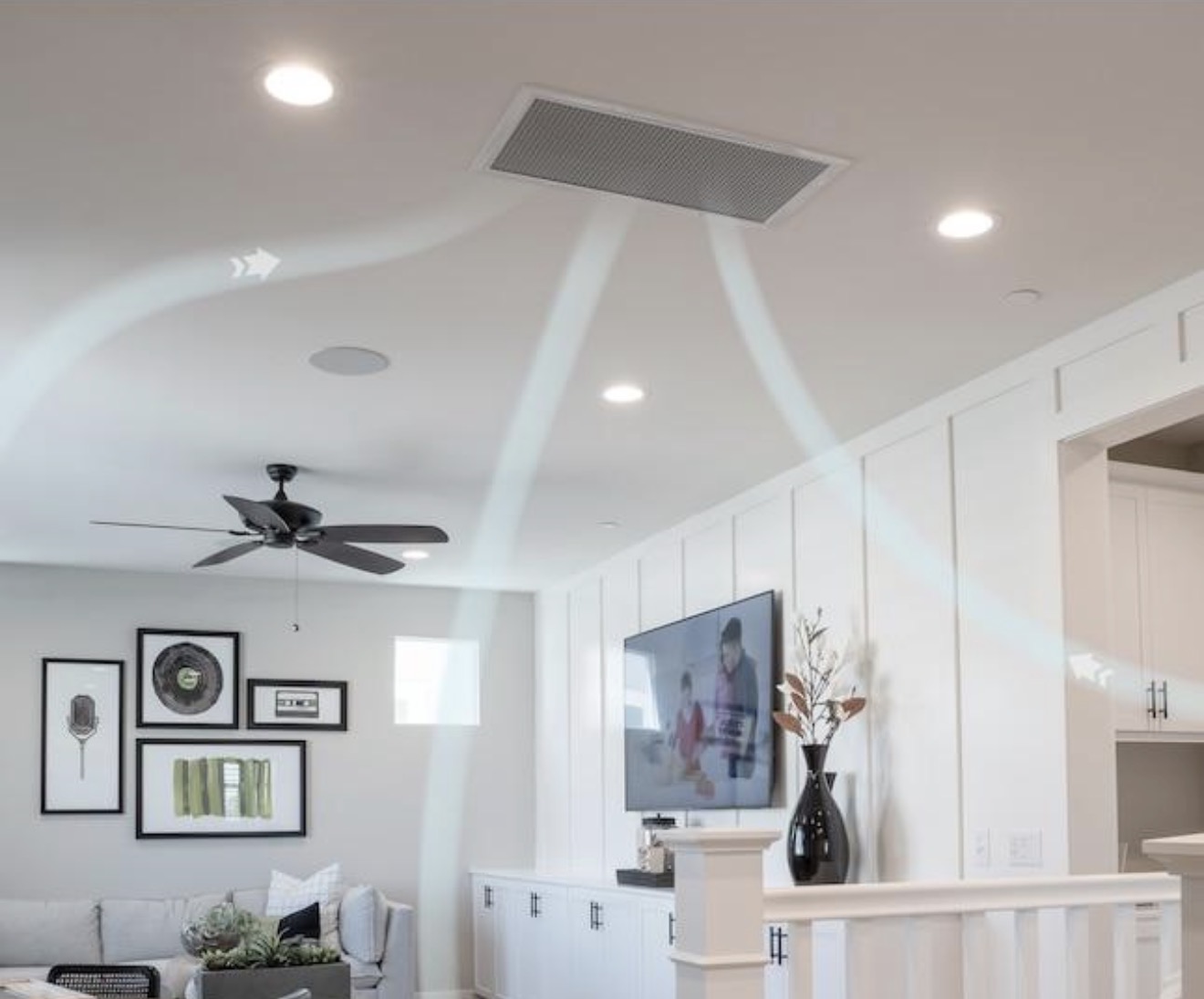 Ceiling-mounted grille pulling air from a bright living room